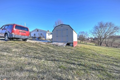 Great investment property/fixer upper with plenty of outdoor on The Crossings Golf Club in Tennessee - for sale on GolfHomes.com, golf home, golf lot