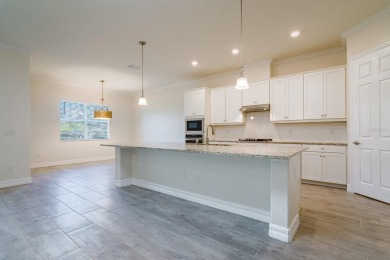 WELCOME TO THIS SOUGHT-AFTER SUMMERVILLE MODEL! This 3-bedroom on Esplanade Golf and Country at Lakewood Ranch in Florida - for sale on GolfHomes.com, golf home, golf lot