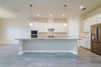 WELCOME TO THIS SOUGHT-AFTER SUMMERVILLE MODEL! This 3-bedroom on Esplanade Golf and Country at Lakewood Ranch in Florida - for sale on GolfHomes.com, golf home, golf lot
