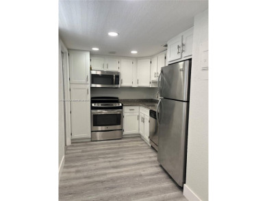 This beautifully remodeled 2-bedroom, 2-bath condo offers on Palm-Aire Country Club and Resort - Palms in Florida - for sale on GolfHomes.com, golf home, golf lot