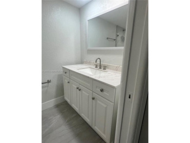 This beautifully remodeled 2-bedroom, 2-bath condo offers on Palm-Aire Country Club and Resort - Palms in Florida - for sale on GolfHomes.com, golf home, golf lot