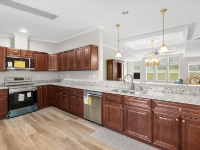 Welcome to this beautifully remodeled 3-bedroom, 2-bath home on Zellwood Station Country Club in Florida - for sale on GolfHomes.com, golf home, golf lot