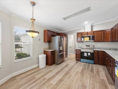 Welcome to this beautifully remodeled 3-bedroom, 2-bath home on Zellwood Station Country Club in Florida - for sale on GolfHomes.com, golf home, golf lot