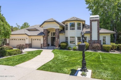 Tucked away on a quiet and prestigious cul-de-sac in the rolling on LakeRidge Golf Course in Nevada - for sale on GolfHomes.com, golf home, golf lot