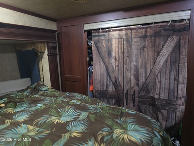 Welcome to coastal living at 120 Quarterdeck Street in North on North Shore Country Club in North Carolina - for sale on GolfHomes.com, golf home, golf lot