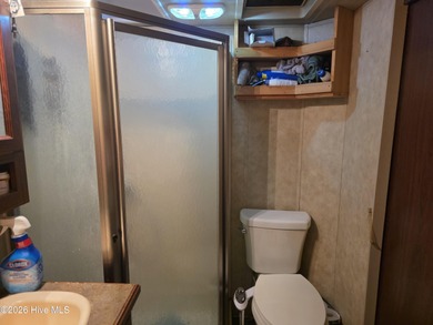 Welcome to coastal living at 120 Quarterdeck Street in North on North Shore Country Club in North Carolina - for sale on GolfHomes.com, golf home, golf lot