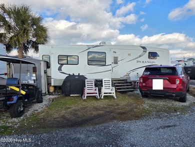 Welcome to coastal living at 120 Quarterdeck Street in North on North Shore Country Club in North Carolina - for sale on GolfHomes.com, golf home, golf lot