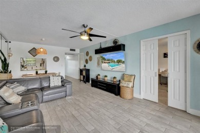 Beautiful condo in Pine Island Ridge's Poinciana community with on Pine Island Ridge Country Club in Florida - for sale on GolfHomes.com, golf home, golf lot