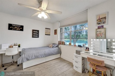 Beautiful condo in Pine Island Ridge's Poinciana community with on Pine Island Ridge Country Club in Florida - for sale on GolfHomes.com, golf home, golf lot
