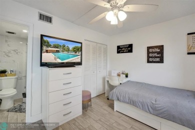 Beautiful condo in Pine Island Ridge's Poinciana community with on Pine Island Ridge Country Club in Florida - for sale on GolfHomes.com, golf home, golf lot