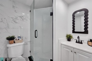 Beautiful condo in Pine Island Ridge's Poinciana community with on Pine Island Ridge Country Club in Florida - for sale on GolfHomes.com, golf home, golf lot