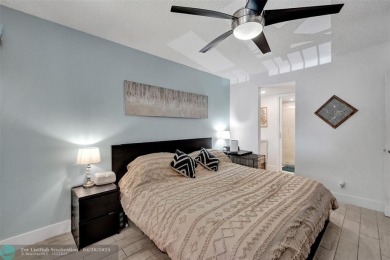 Beautiful condo in Pine Island Ridge's Poinciana community with on Pine Island Ridge Country Club in Florida - for sale on GolfHomes.com, golf home, golf lot