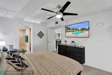 Beautiful condo in Pine Island Ridge's Poinciana community with on Pine Island Ridge Country Club in Florida - for sale on GolfHomes.com, golf home, golf lot