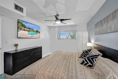 Beautiful condo in Pine Island Ridge's Poinciana community with on Pine Island Ridge Country Club in Florida - for sale on GolfHomes.com, golf home, golf lot
