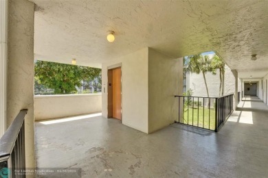Beautiful condo in Pine Island Ridge's Poinciana community with on Pine Island Ridge Country Club in Florida - for sale on GolfHomes.com, golf home, golf lot