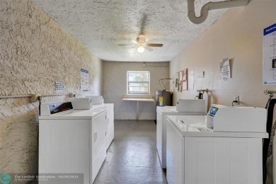 Beautiful condo in Pine Island Ridge's Poinciana community with on Pine Island Ridge Country Club in Florida - for sale on GolfHomes.com, golf home, golf lot