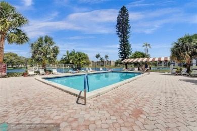 Beautiful condo in Pine Island Ridge's Poinciana community with on Pine Island Ridge Country Club in Florida - for sale on GolfHomes.com, golf home, golf lot