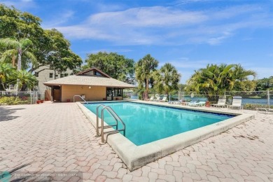 Beautiful condo in Pine Island Ridge's Poinciana community with on Pine Island Ridge Country Club in Florida - for sale on GolfHomes.com, golf home, golf lot