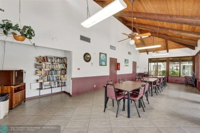Beautiful condo in Pine Island Ridge's Poinciana community with on Pine Island Ridge Country Club in Florida - for sale on GolfHomes.com, golf home, golf lot