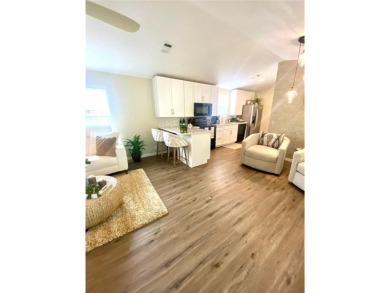 Enjoy the perfect blend of style & comfort in this partially on Mangrove Bay Golf Course in Florida - for sale on GolfHomes.com, golf home, golf lot