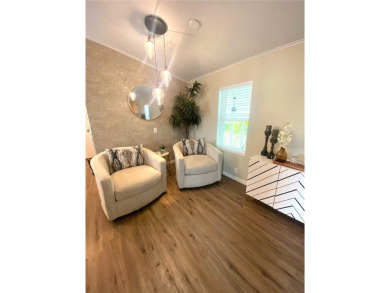 Enjoy the perfect blend of style & comfort in this partially on Mangrove Bay Golf Course in Florida - for sale on GolfHomes.com, golf home, golf lot