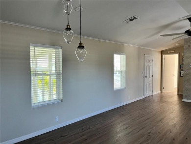 Enjoy the perfect blend of style & comfort in this partially on Mangrove Bay Golf Course in Florida - for sale on GolfHomes.com, golf home, golf lot