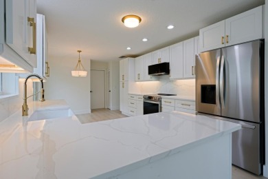 This home in Monarch Country Club is located on the 15th fairway on Monarch Country Club in Florida - for sale on GolfHomes.com, golf home, golf lot