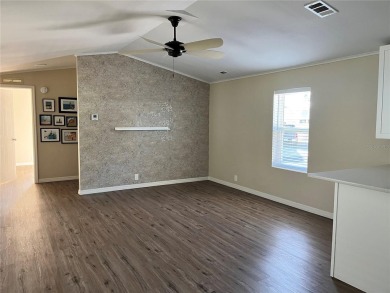 Enjoy the perfect blend of style & comfort in this partially on Mangrove Bay Golf Course in Florida - for sale on GolfHomes.com, golf home, golf lot