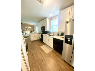 Enjoy the perfect blend of style & comfort in this partially on Mangrove Bay Golf Course in Florida - for sale on GolfHomes.com, golf home, golf lot
