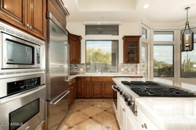Nestled in a quiet cul-de-sac with sweeping mountain views from on Desert Highlands Golf Club in Arizona - for sale on GolfHomes.com, golf home, golf lot