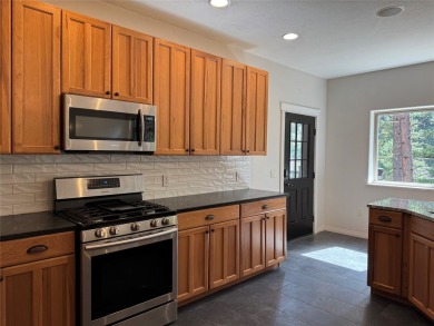 Welcome to your Montana dream retreat! This exceptional property on Trestle Creek Golf Course in Montana - for sale on GolfHomes.com, golf home, golf lot