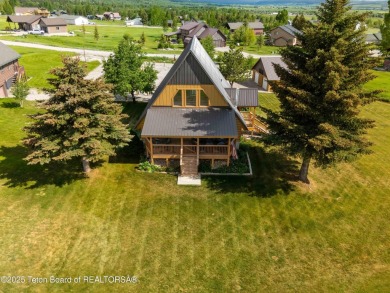 Experience luxury living in this beautiful home, perfectly on Cedar Creek Golf Course in Wyoming - for sale on GolfHomes.com, golf home, golf lot
