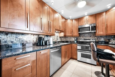 Beautifully furnished penthouse in a secure, resort-style gated on Inverrary Country Club in Florida - for sale on GolfHomes.com, golf home, golf lot