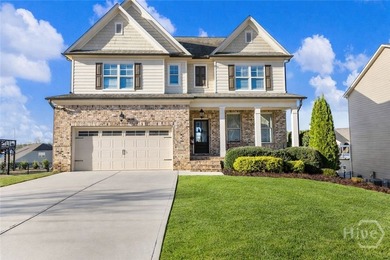 Welcome Home to Traditions of Braselton, where everyday living on Traditions of Braselton Golf Club in Georgia - for sale on GolfHomes.com, golf home, golf lot