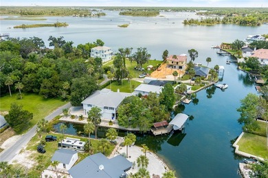 This updated waterfront stilt (DID NOT FLOOD) home in Crystal on Plantation Inn and Golf Resort  in Florida - for sale on GolfHomes.com, golf home, golf lot