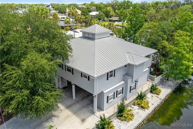 This updated waterfront stilt (DID NOT FLOOD) home in Crystal on Plantation Inn and Golf Resort  in Florida - for sale on GolfHomes.com, golf home, golf lot