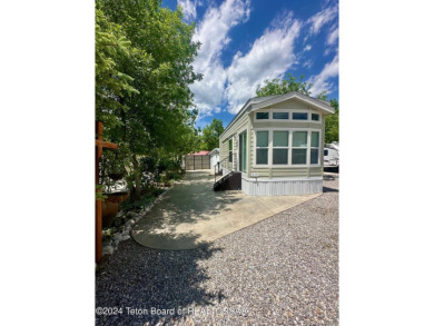 Beautifully maintained, immaculate 2022 CAVCO unit in the Star on Star Valley RV Golf Course in Wyoming - for sale on GolfHomes.com, golf home, golf lot