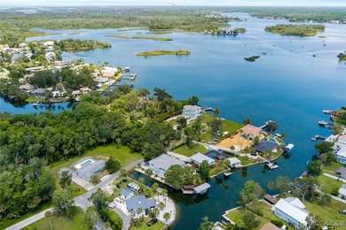 This updated waterfront stilt (DID NOT FLOOD) home in Crystal on Plantation Inn and Golf Resort  in Florida - for sale on GolfHomes.com, golf home, golf lot
