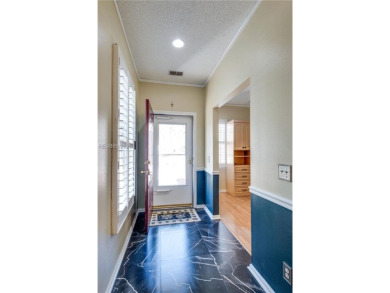 Start and end your days enjoying lagoon and wood views from your on Hidden Cypress Golf Club in South Carolina - for sale on GolfHomes.com, golf home, golf lot