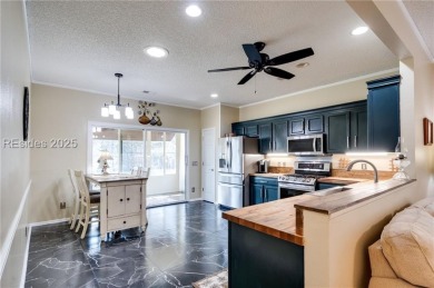 Start and end your days enjoying lagoon and wood views from your on Hidden Cypress Golf Club in South Carolina - for sale on GolfHomes.com, golf home, golf lot