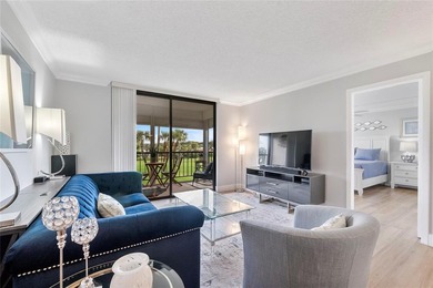 You'll fall in love with this move-in ready & beautifully on Hillsboro Pines Golf in Florida - for sale on GolfHomes.com, golf home, golf lot