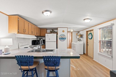 Welcome to the ultimate turnkey escape! Just a few miles from on Brick Landing Plantation Yacht and Golf Club in North Carolina - for sale on GolfHomes.com, golf home, golf lot