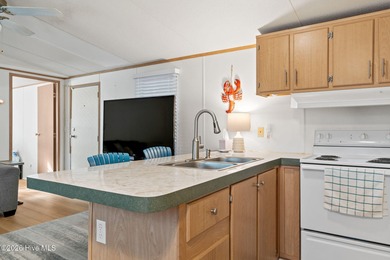 Welcome to the ultimate turnkey escape! Just a few miles from on Brick Landing Plantation Yacht and Golf Club in North Carolina - for sale on GolfHomes.com, golf home, golf lot