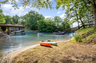 Why just live near the lake when you can live on it? This on Tega Cay Golf Club in South Carolina - for sale on GolfHomes.com, golf home, golf lot