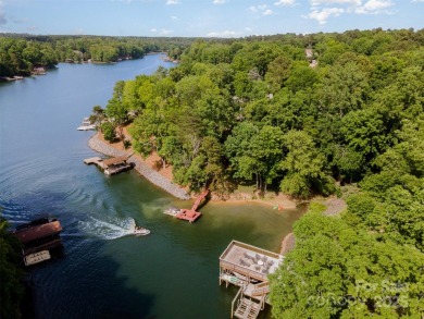 Why just live near the lake when you can live on it? This on Tega Cay Golf Club in South Carolina - for sale on GolfHomes.com, golf home, golf lot