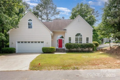 Why just live near the lake when you can live on it? This on Tega Cay Golf Club in South Carolina - for sale on GolfHomes.com, golf home, golf lot