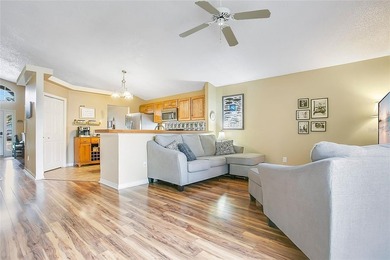 Immaculate home in highly desirable Waterford Lakes, nestled on on Eastwood Golf Club in Florida - for sale on GolfHomes.com, golf home, golf lot