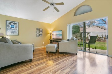 Immaculate home in highly desirable Waterford Lakes, nestled on on Eastwood Golf Club in Florida - for sale on GolfHomes.com, golf home, golf lot