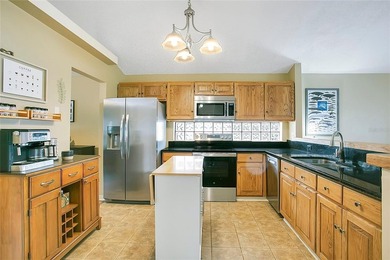 Immaculate home in highly desirable Waterford Lakes, nestled on on Eastwood Golf Club in Florida - for sale on GolfHomes.com, golf home, golf lot