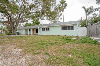 This home lies amongst water front estates on the beautiful on The Dunedin Country Club in Florida - for sale on GolfHomes.com, golf home, golf lot